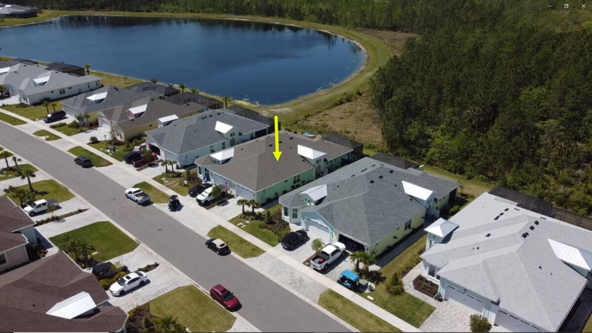 Aerial-Front&RightSide-WithLakeToLeft-710_Coral_Reef_Way-Drones_And_Homes_Photgraphy_Daytona